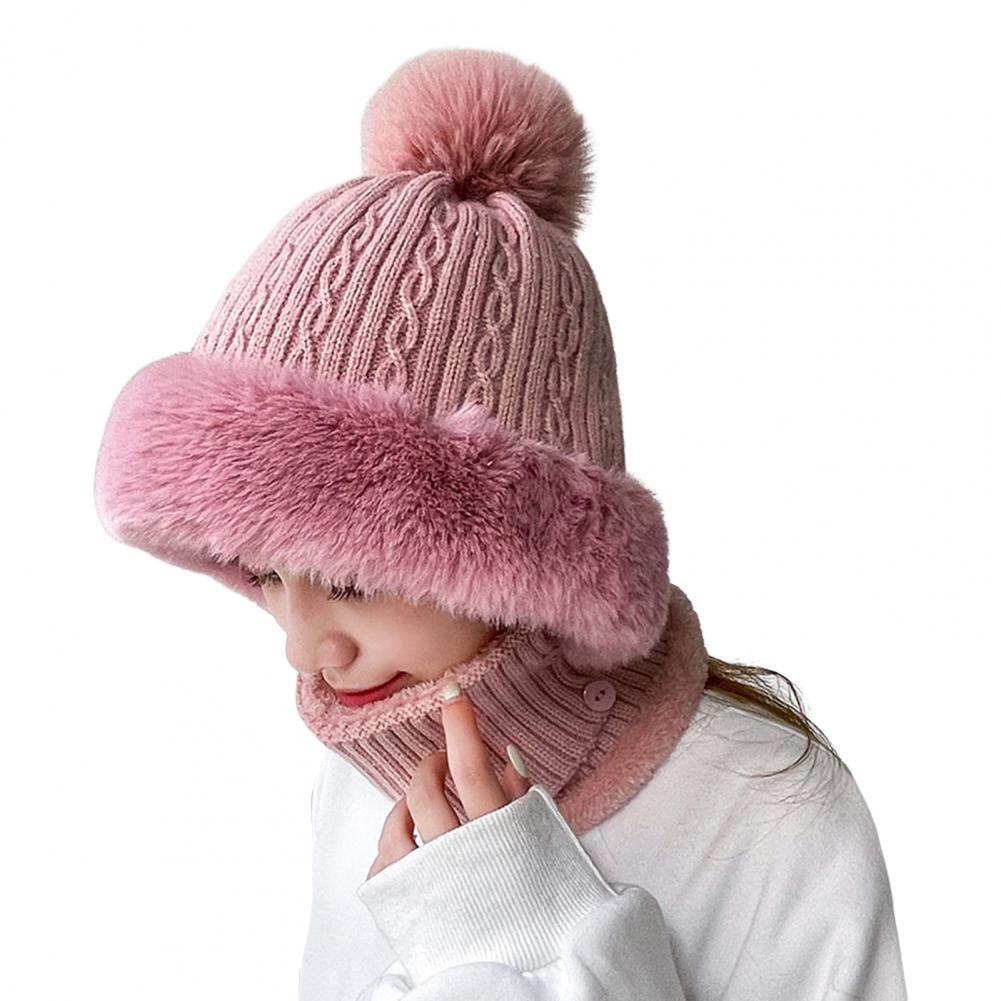 A cozy knitted hat with pompom plush ears, designed for women, in solid color, perfect for autumn and winter outdoor activities.