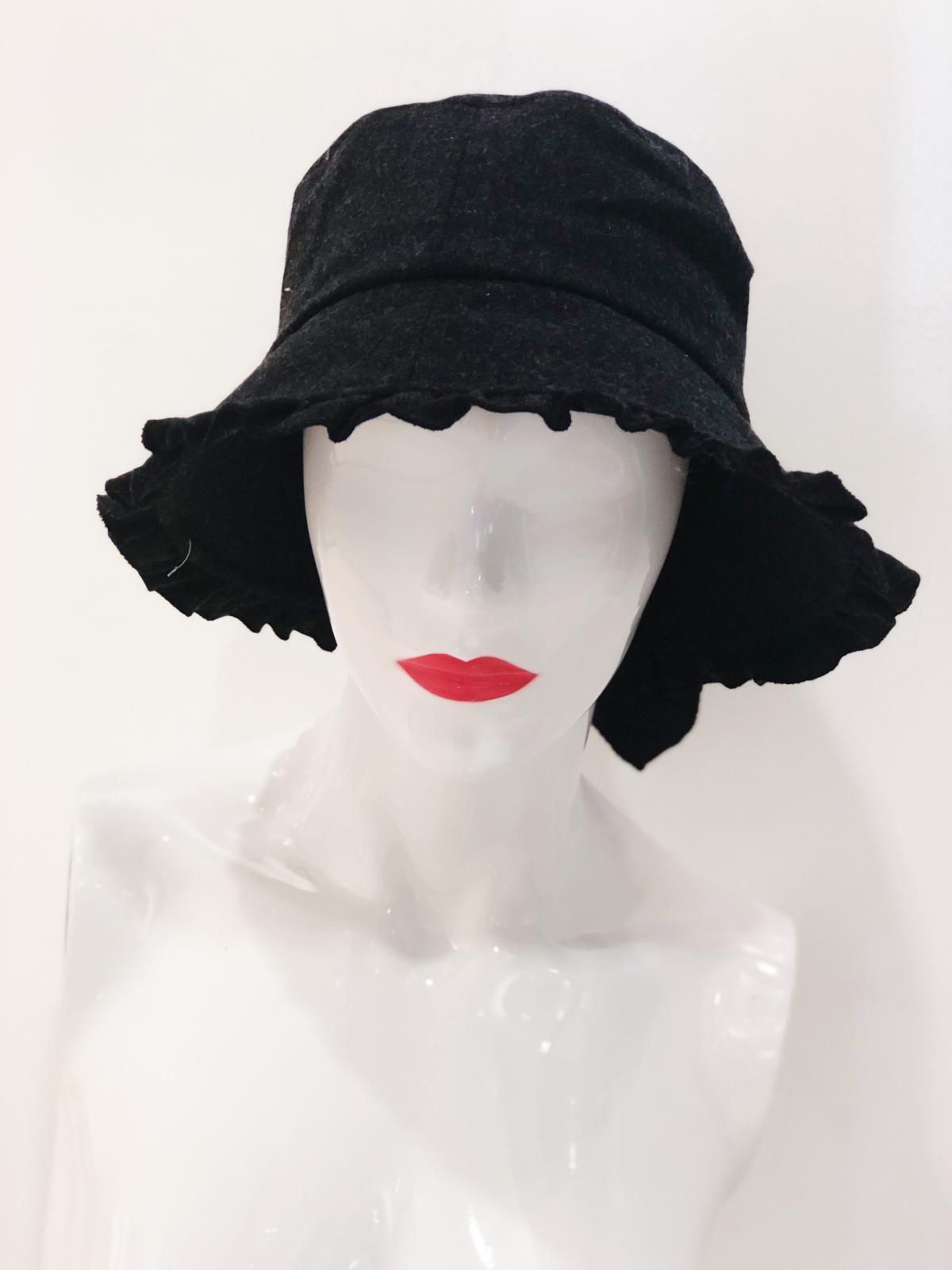 A stylish 'Macy' Black Bucket Hat displayed on a white background, showcasing its trendy design and comfortable fit.