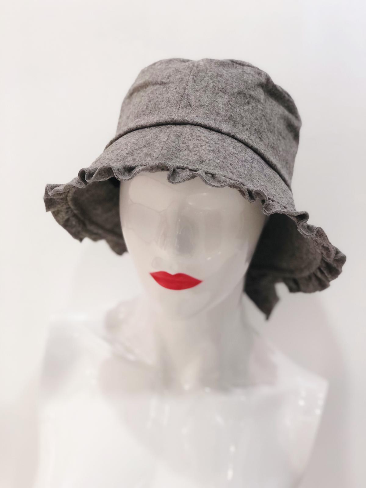 Stylish 'Macy' Grey Bucket Hat with wide brim, perfect for sun protection and fashion.