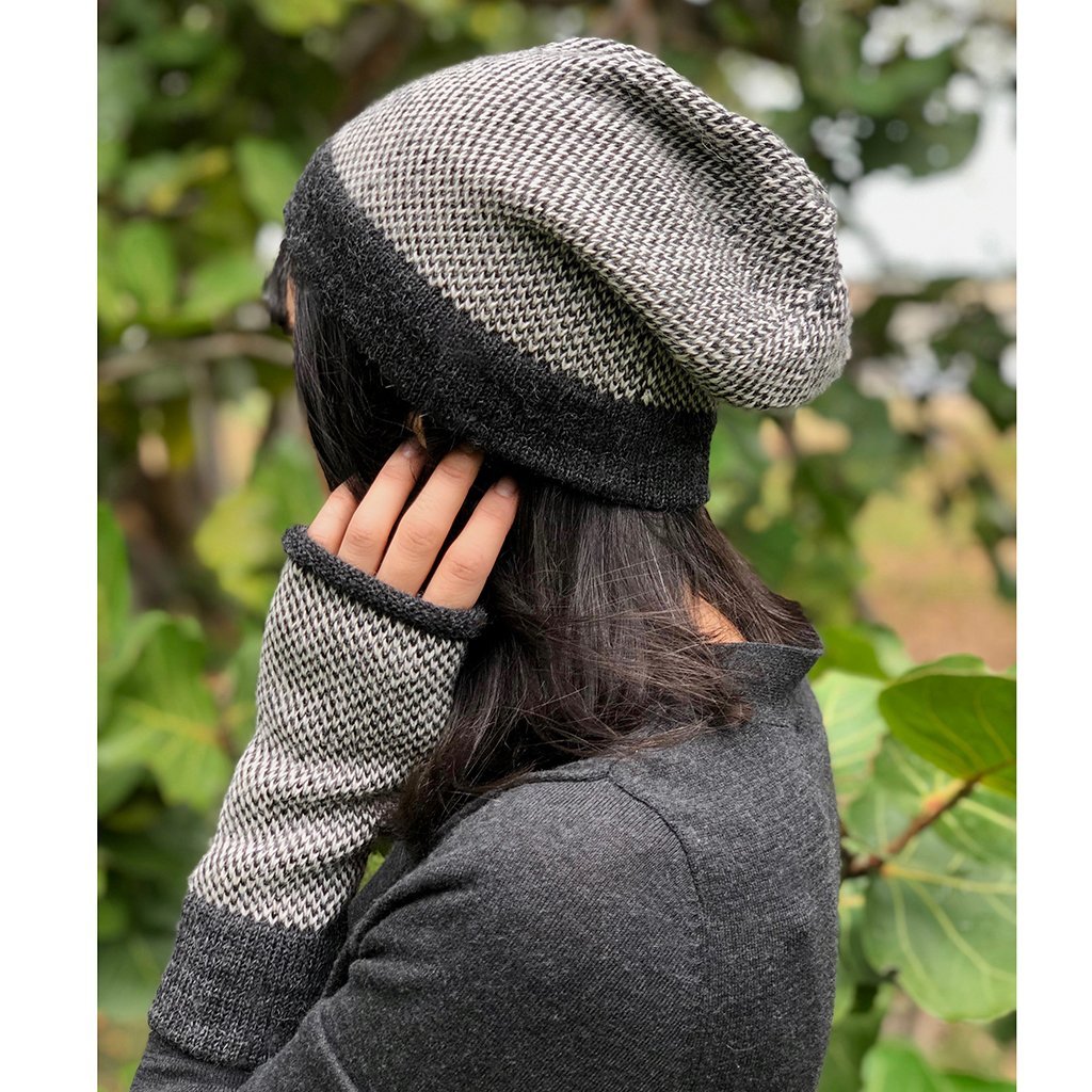 Midnight Interwoven Alpaca Beanie featuring a textured black and white design, showcasing its luxurious alpaca fiber and slouchy style.