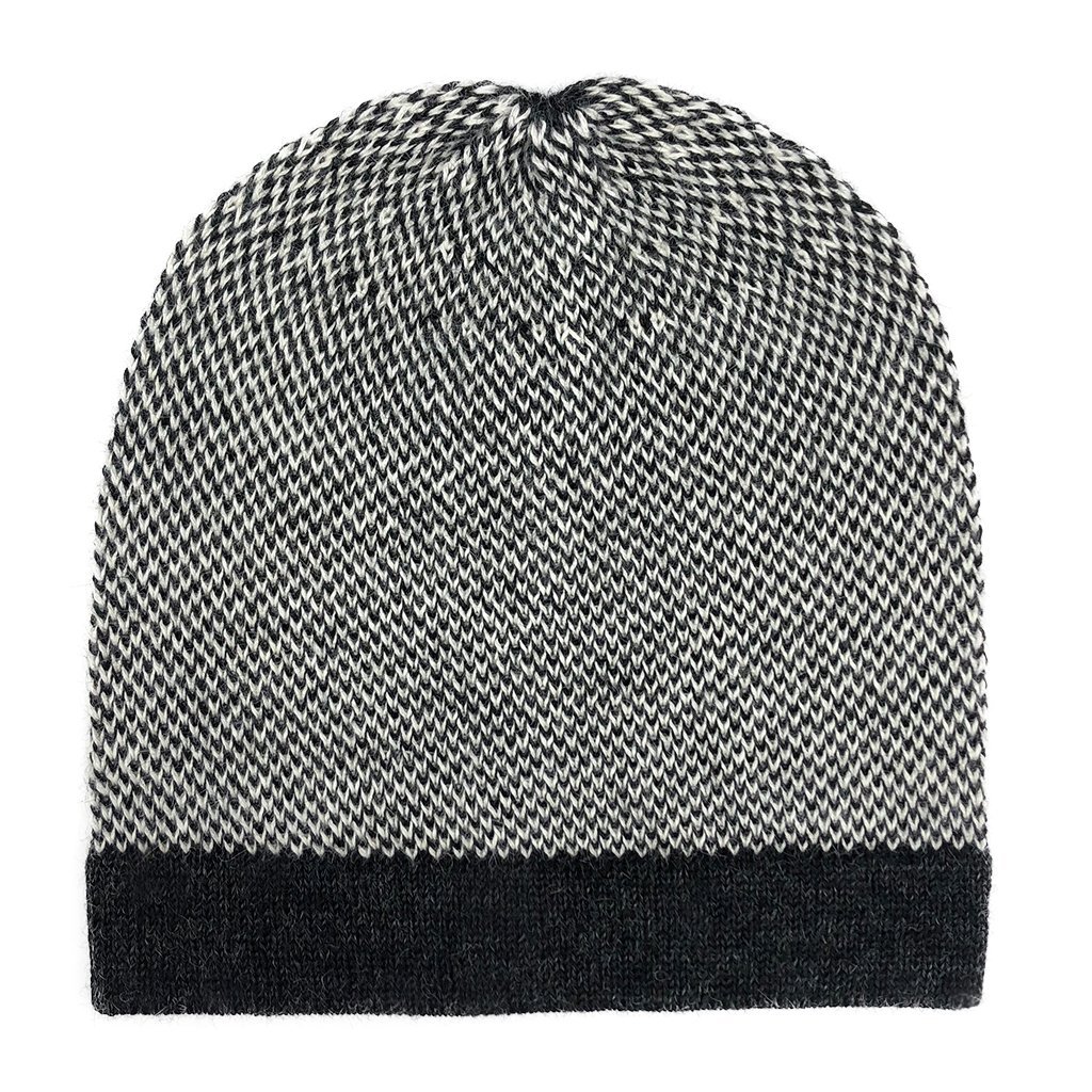 Midnight Interwoven Alpaca Beanie featuring a textured black and white design, showcasing its luxurious alpaca fiber and slouchy style.