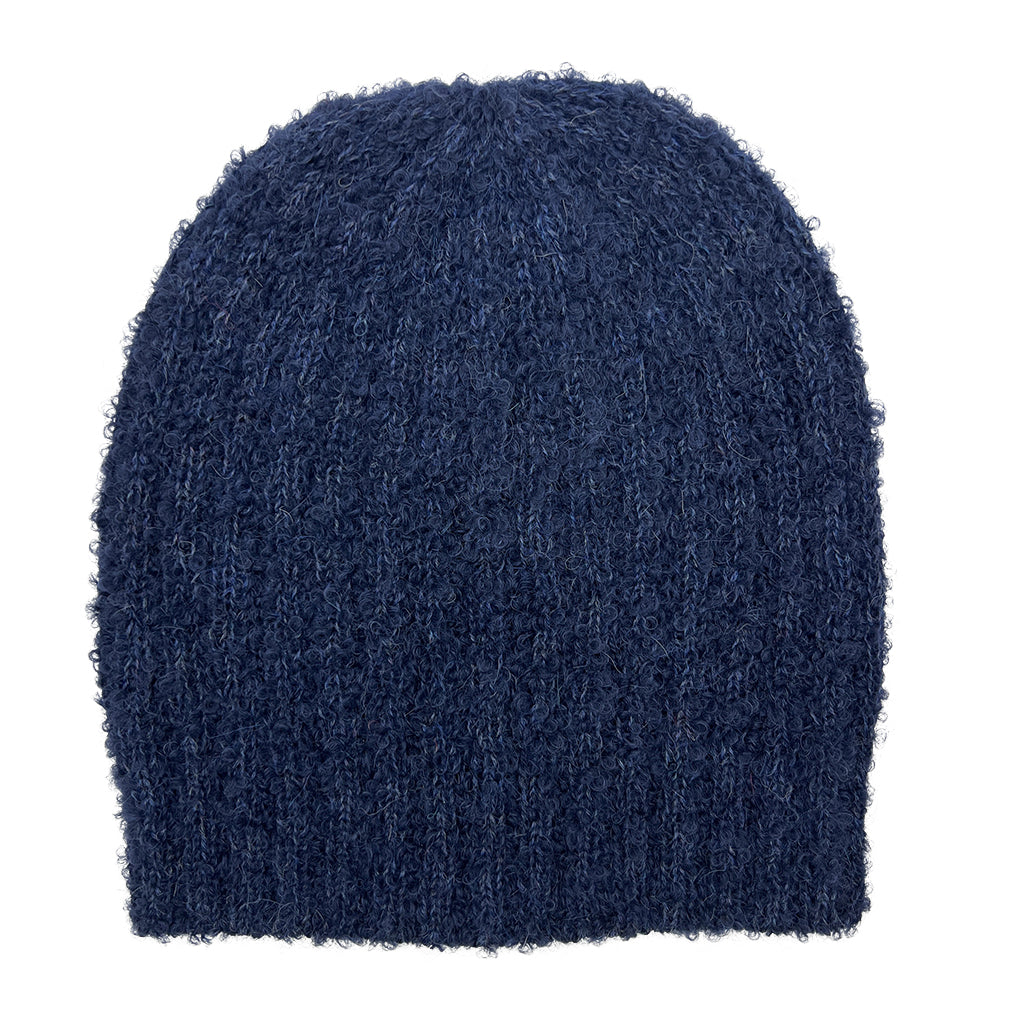 Navy Loop Knit Alpaca Beanie showcasing a slouchy design with subtle ribbed stripes, made from soft alpaca fiber.