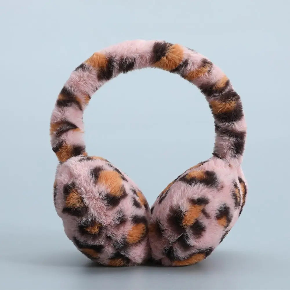 Plush earmuffs in a stylish design, perfect for winter outdoor activities, showcasing soft material and foldable feature.