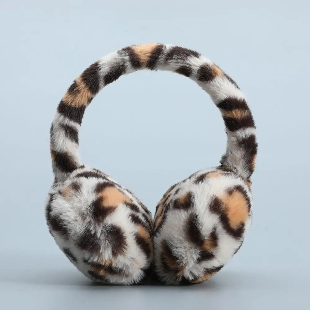 Plush earmuffs in a stylish design, perfect for winter outdoor activities, showcasing soft material and foldable feature.