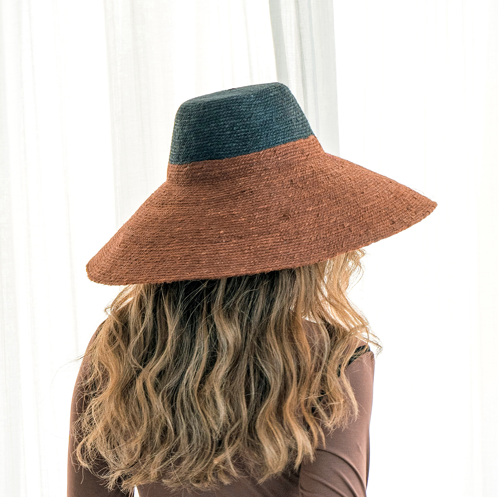 RIRI DUO Jute Straw Hat in burnt sienna and black, featuring a sculpted crown and wide brim, perfect for sun protection.