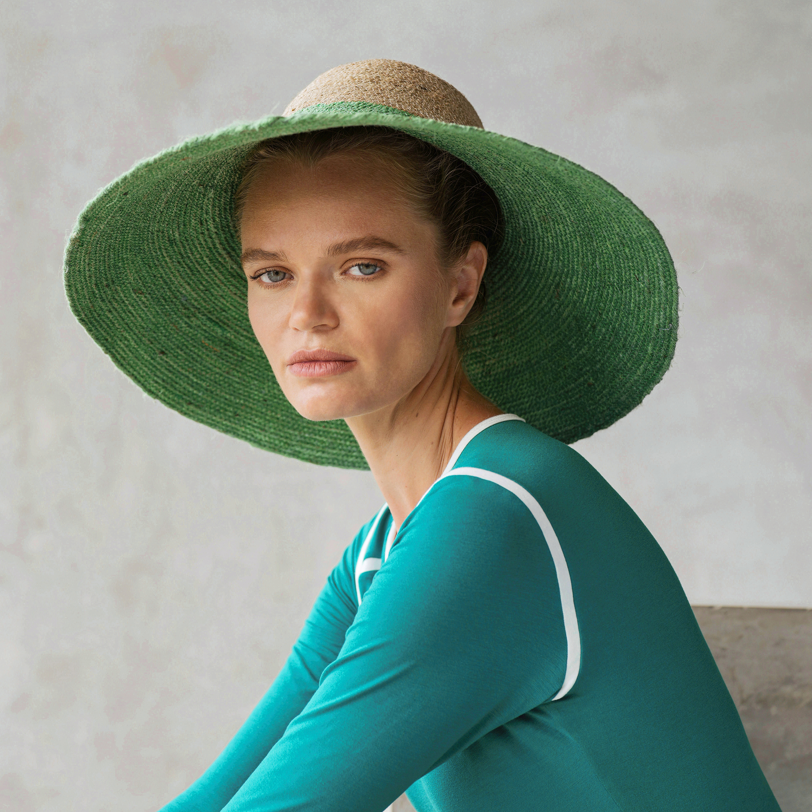 RIRI DUO Jute Straw Hat in natural and Kelly green colors, featuring a sculpted crown and wide brim, perfect for sun protection.