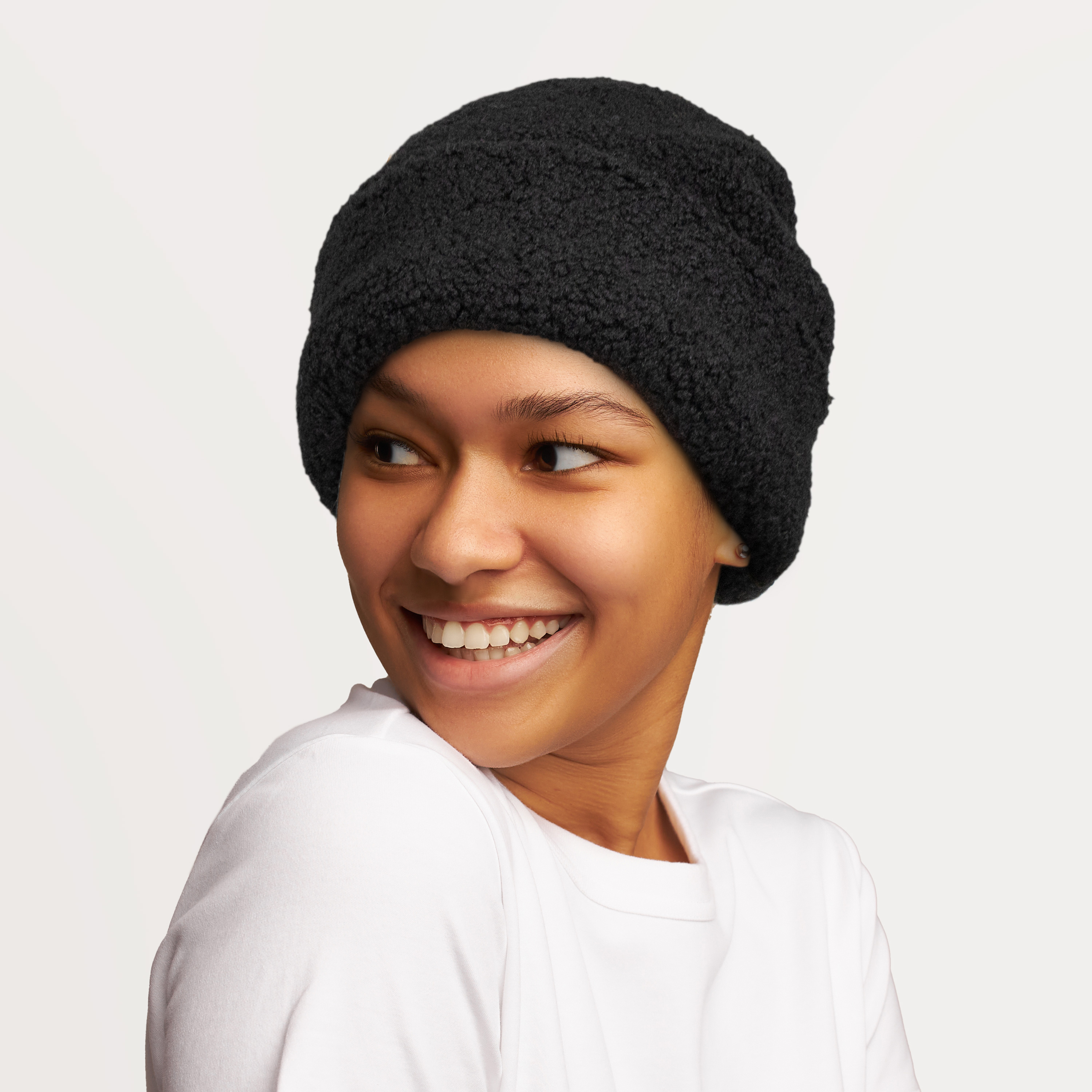 A cozy Sherpa Beanie with adjustable fit and UV protection, perfect for winter and outdoor activities.