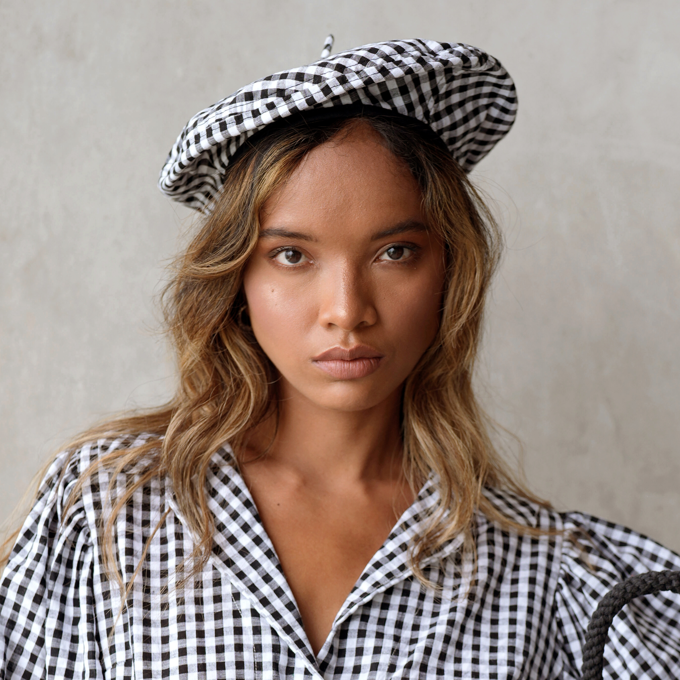 SIMONE Gingham Beret Hat in Black, made from soft gingham cotton with a comfy linen lining, showcasing its stylish design.