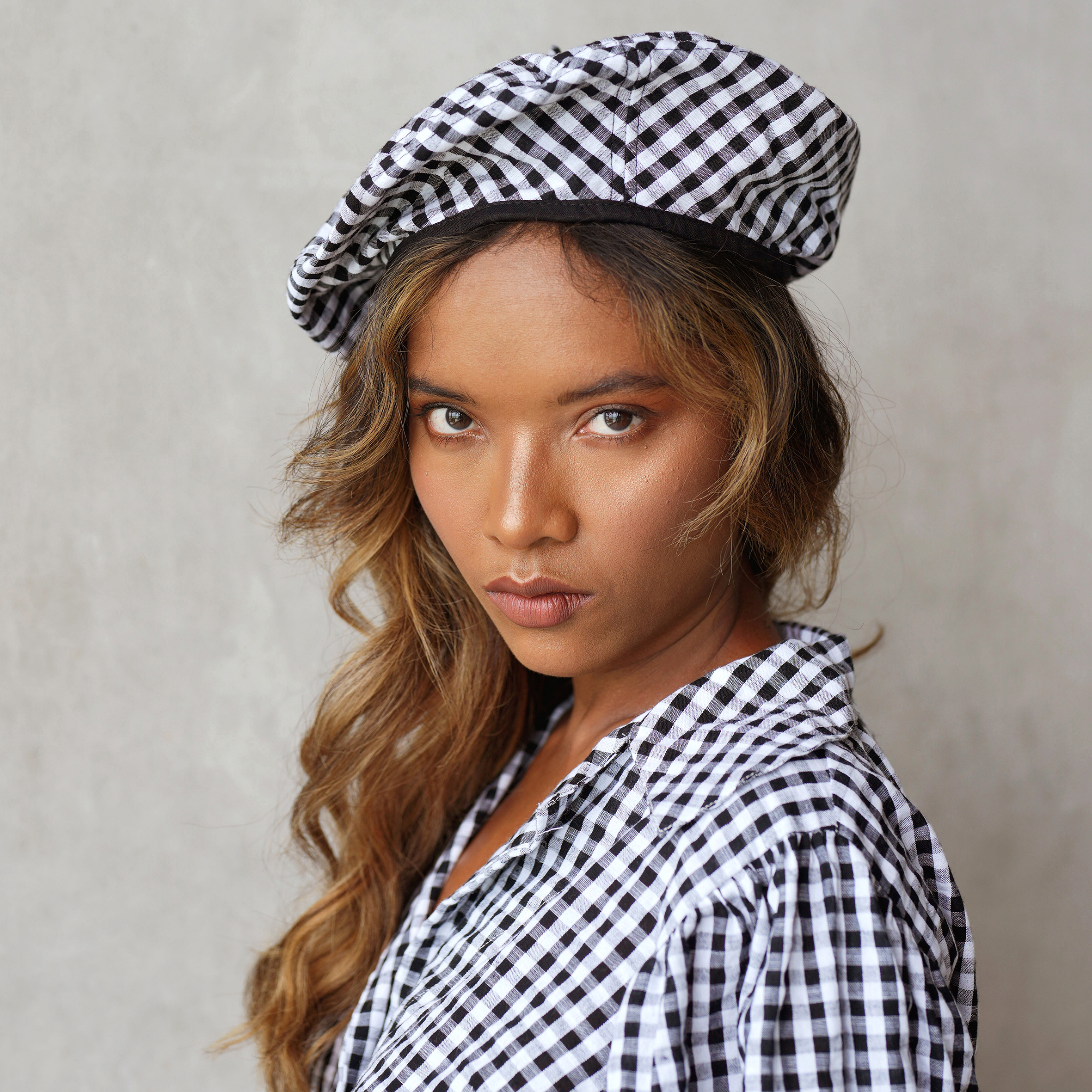 SIMONE Gingham Beret Hat in Black, made from soft gingham cotton with a comfy linen lining, showcasing its stylish design.