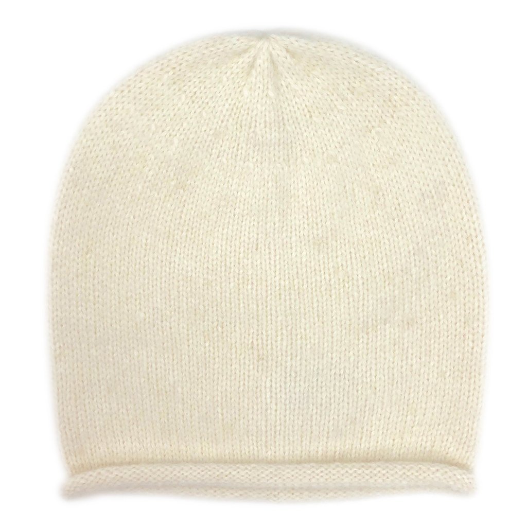 A stylish Snow Essential Knit Alpaca Beanie in a soft snow color, showcasing its slouchy design and luxurious texture, perfect for winter wear.