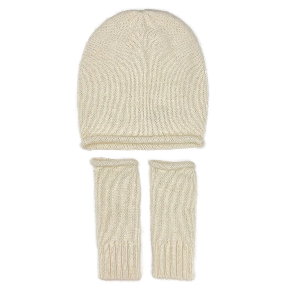 A stylish Snow Essential Knit Alpaca Beanie in a soft snow color, showcasing its slouchy design and luxurious texture, perfect for winter wear.