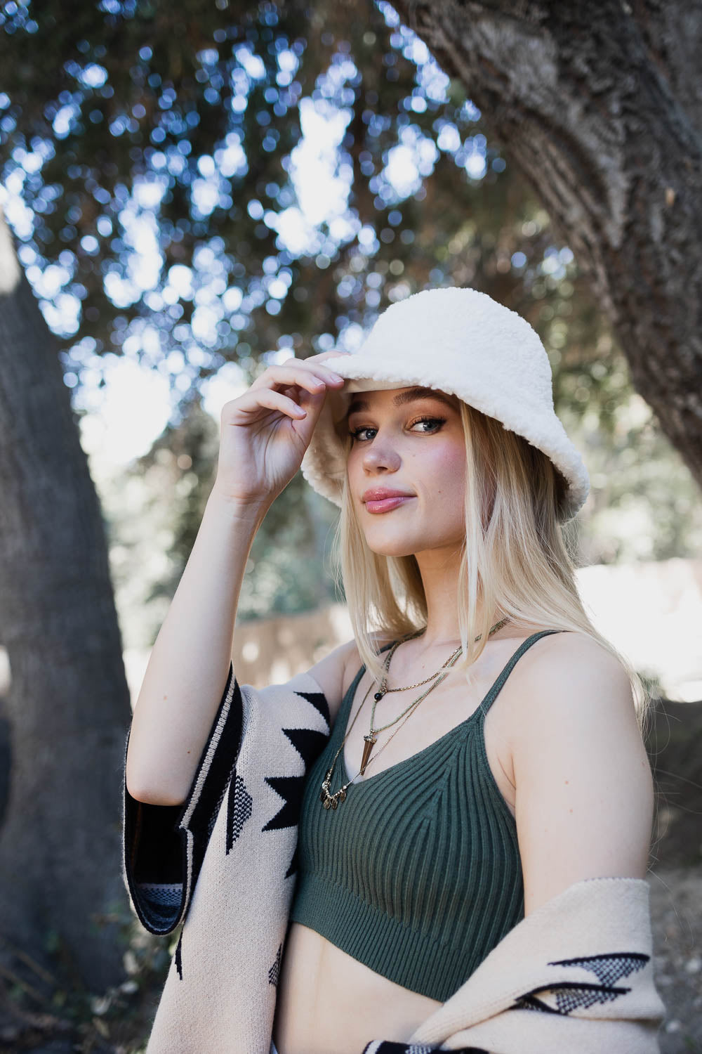 Teddy Suede Combo Reversible Bucket Hat in soft teddy suede, showcasing its stylish design and reversible feature.