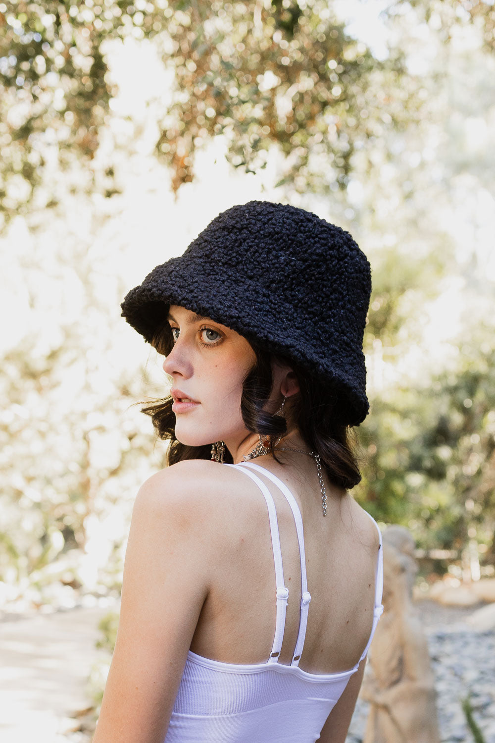 Teddy Suede Combo Reversible Bucket Hat in soft teddy suede, showcasing its stylish design and reversible feature.