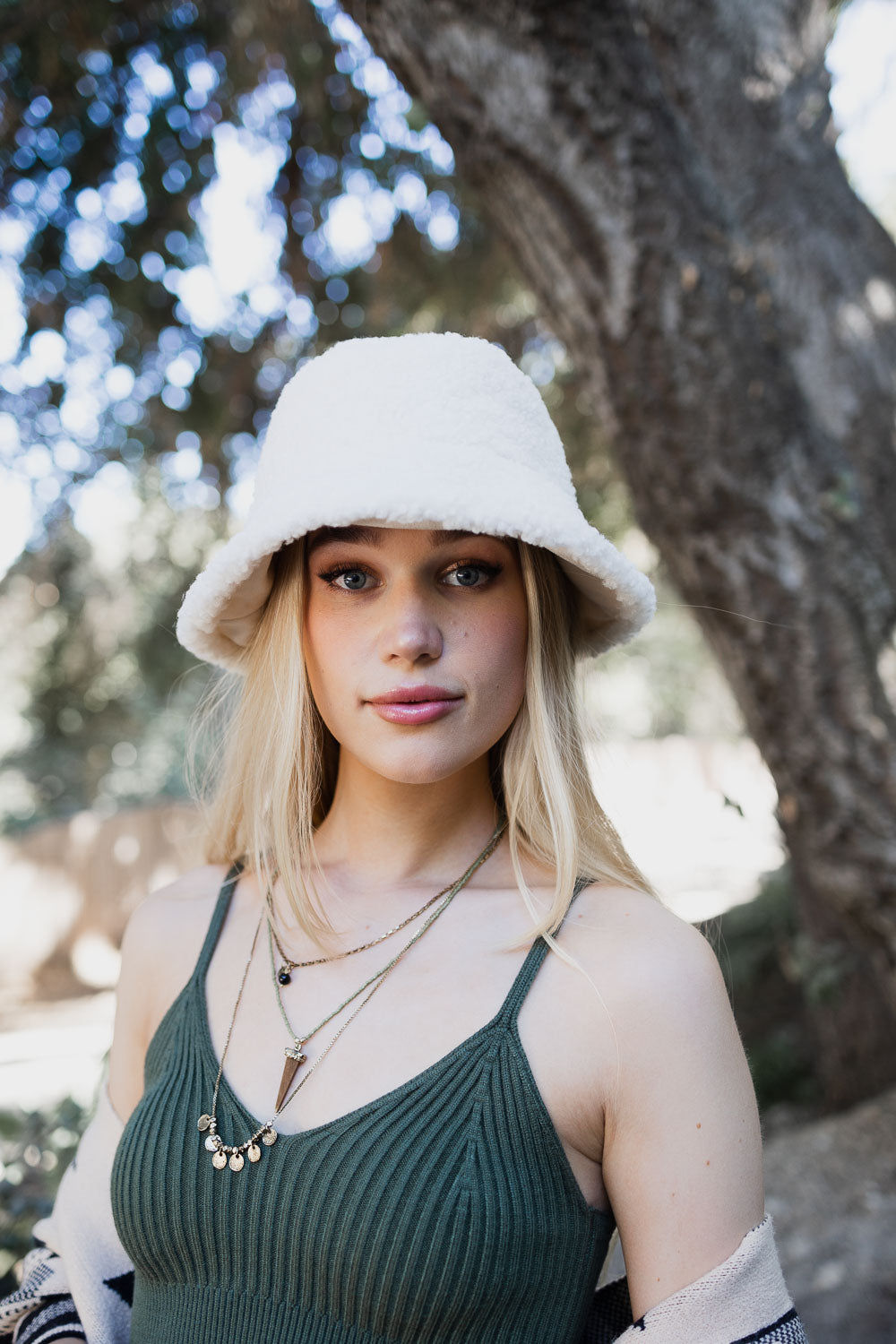 Teddy Suede Combo Reversible Bucket Hat in soft teddy suede, showcasing its stylish design and reversible feature.