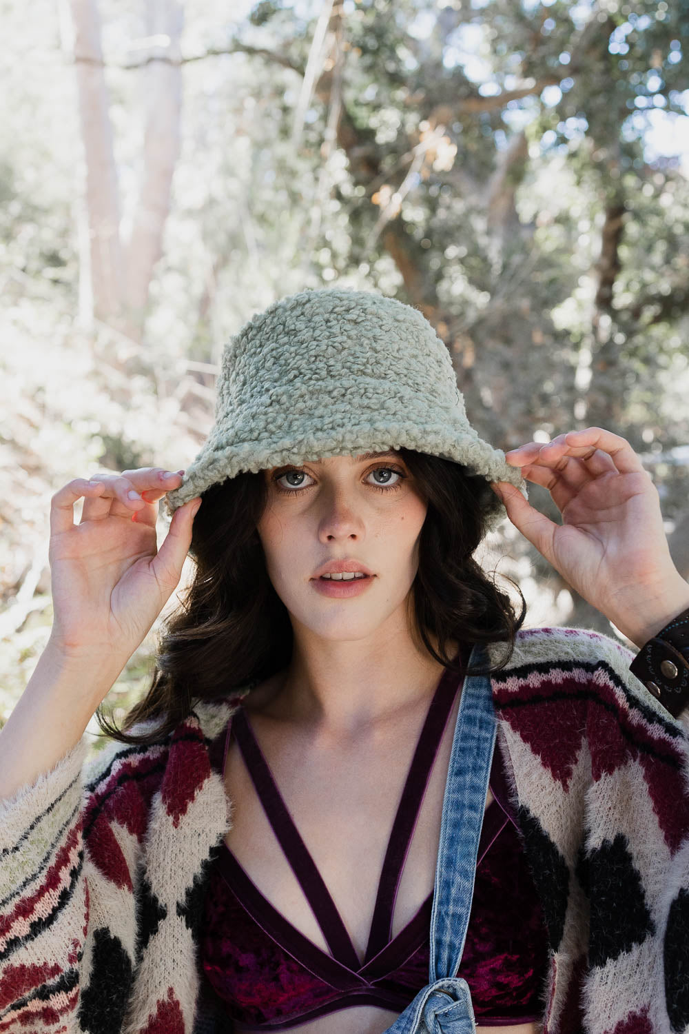 Teddy Suede Combo Reversible Bucket Hat in soft teddy suede, showcasing its stylish design and reversible feature.