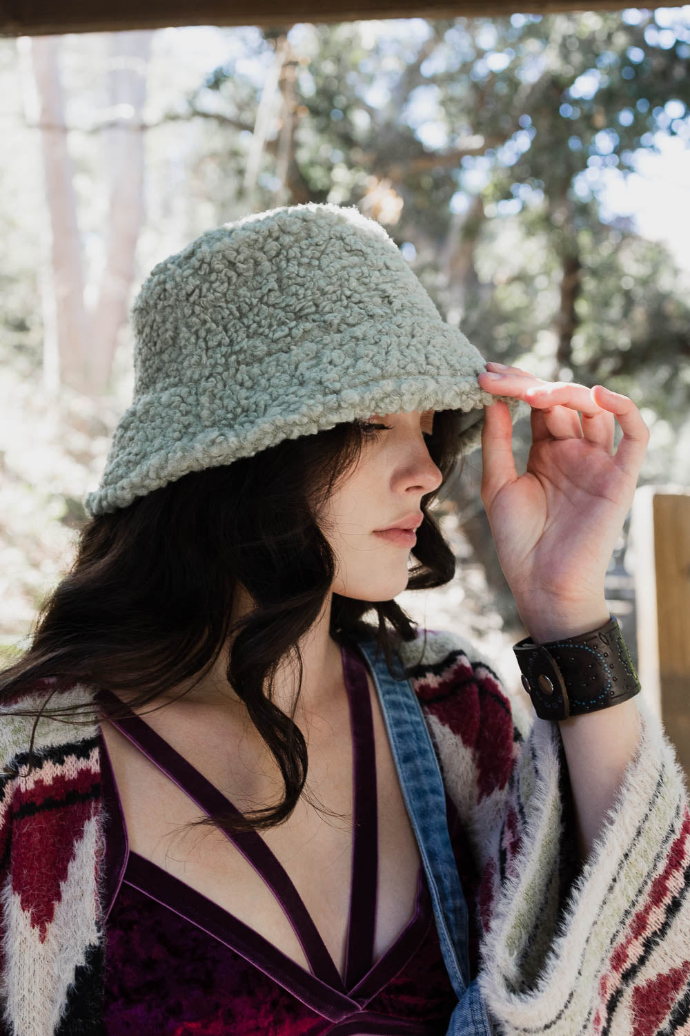 Teddy Suede Combo Reversible Bucket Hat in soft teddy suede, showcasing its stylish design and reversible feature.