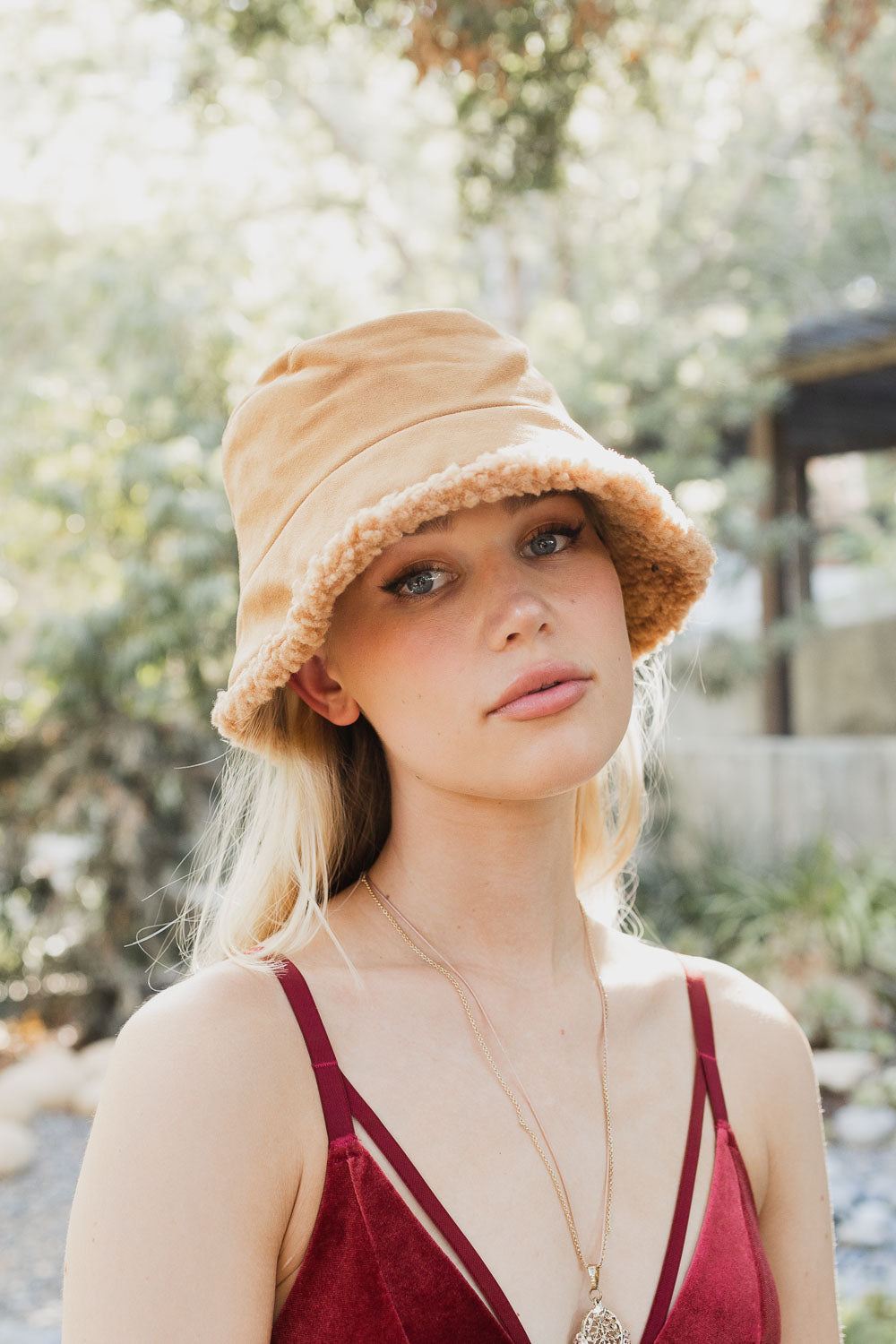 Teddy Suede Combo Reversible Bucket Hat in soft teddy suede, showcasing its stylish design and reversible feature.