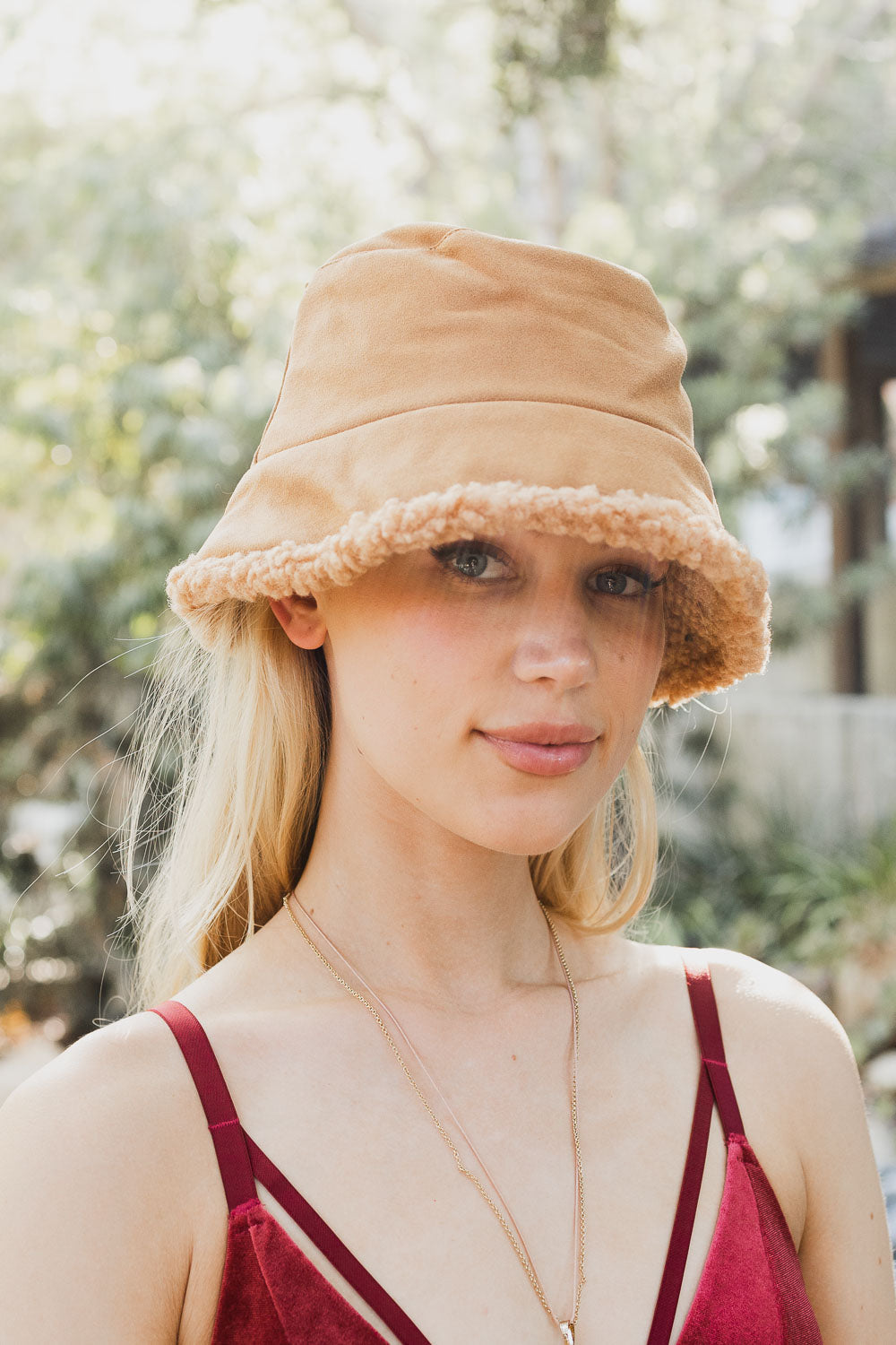 Teddy Suede Combo Reversible Bucket Hat in soft teddy suede, showcasing its stylish design and reversible feature.