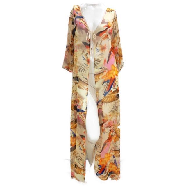 A vibrant 'Tropical Orange' Chiffon Cardigan draped elegantly, showcasing its lightweight fabric and open-front design.