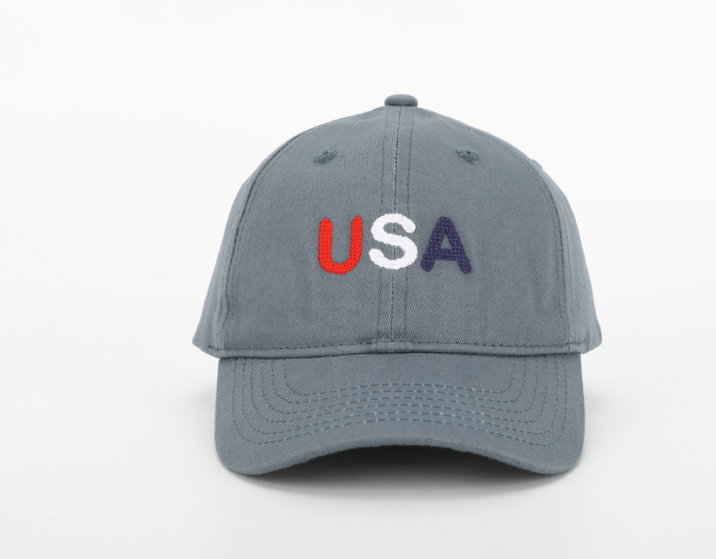 USA Hat for children featuring a cognac leather adjustable strap and needlepoint embroidery designs.