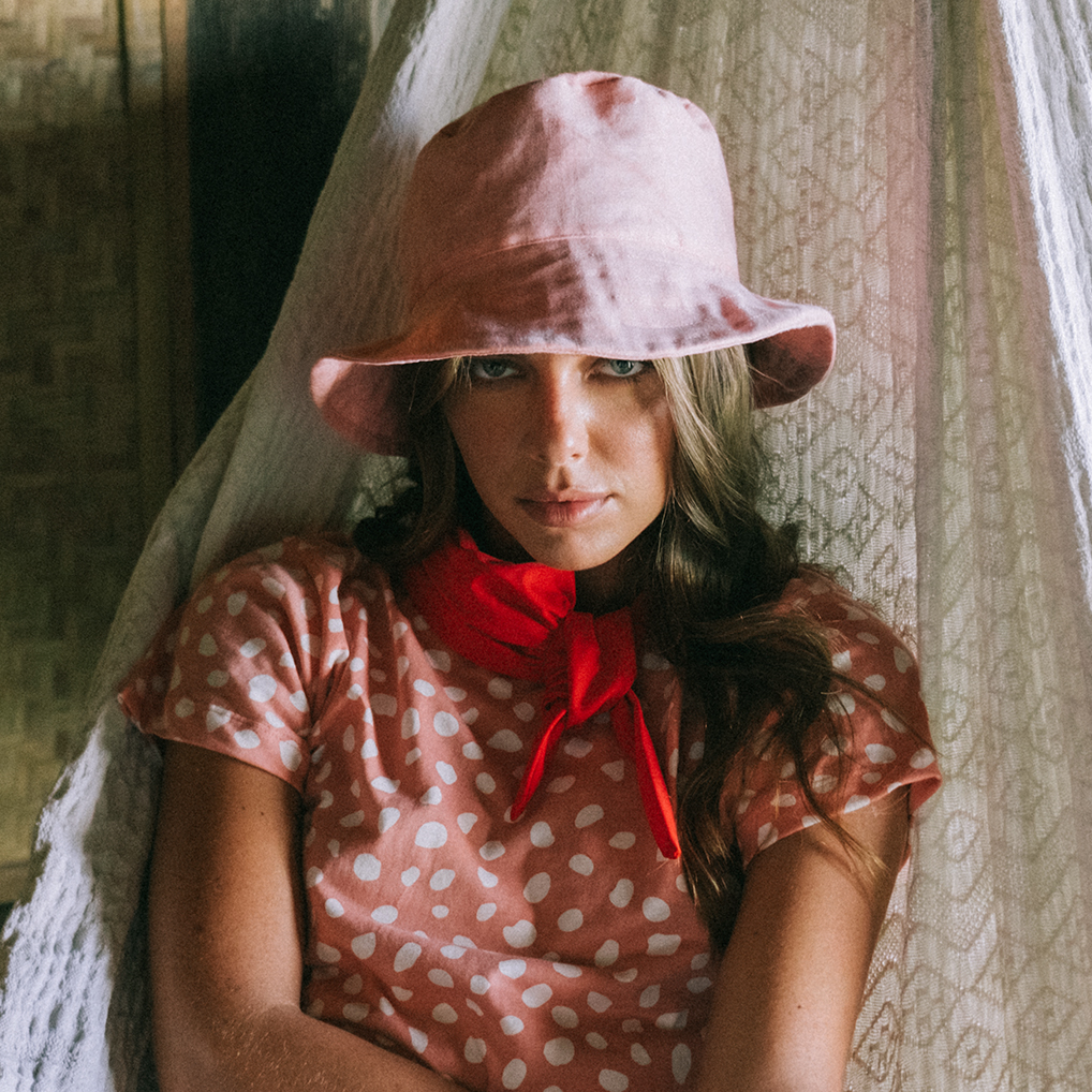 WATU Seaside Linen Bucket Hat in Salt Pink, showcasing its vibrant color and stylish design, perfect for sunny days.