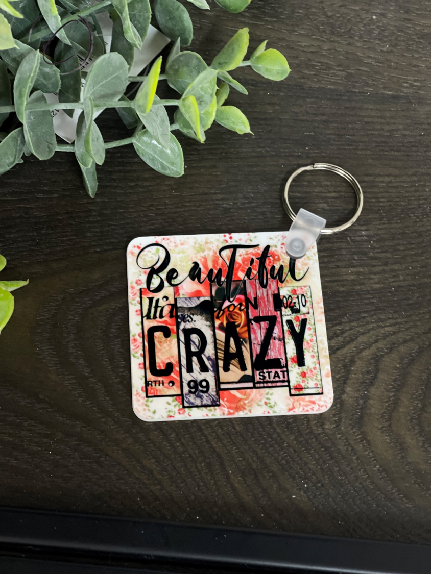 Beautiful Crazy Keychain featuring a vibrant double-sided design, made from durable plastic, measuring 2.25 inches square.