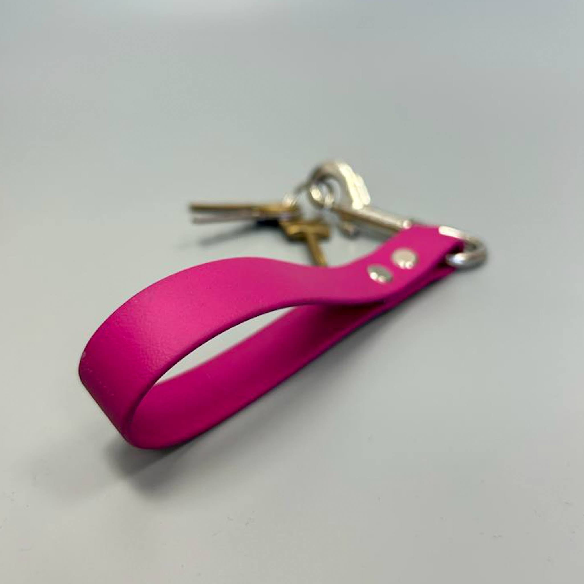 A colorful BioThane key ring designed to match dog collars, showcasing its durable and waterproof material.