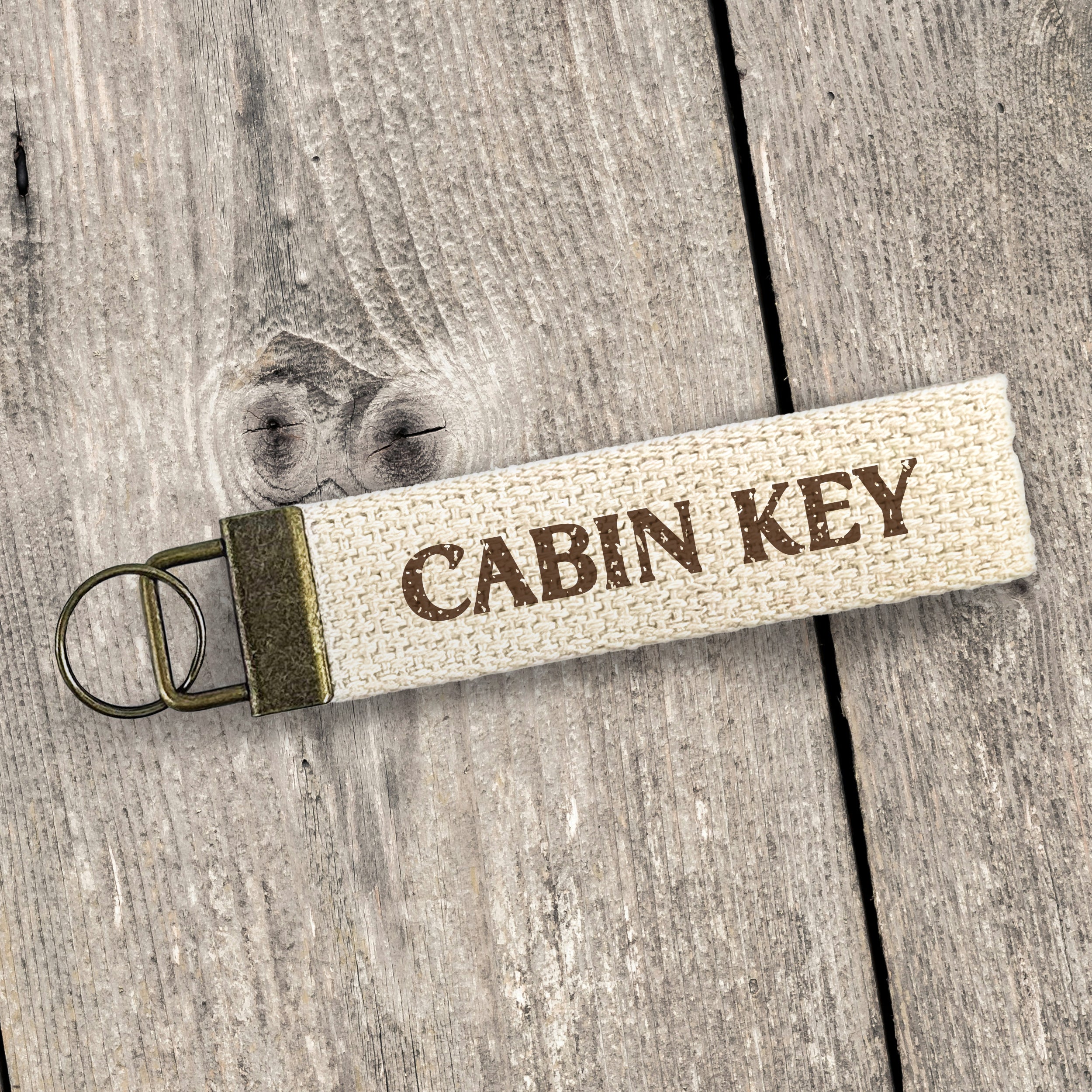 Cabin Key - Canvas Key Fob featuring heavy duty cotton webbing and durable bronze hardware in a natural color.