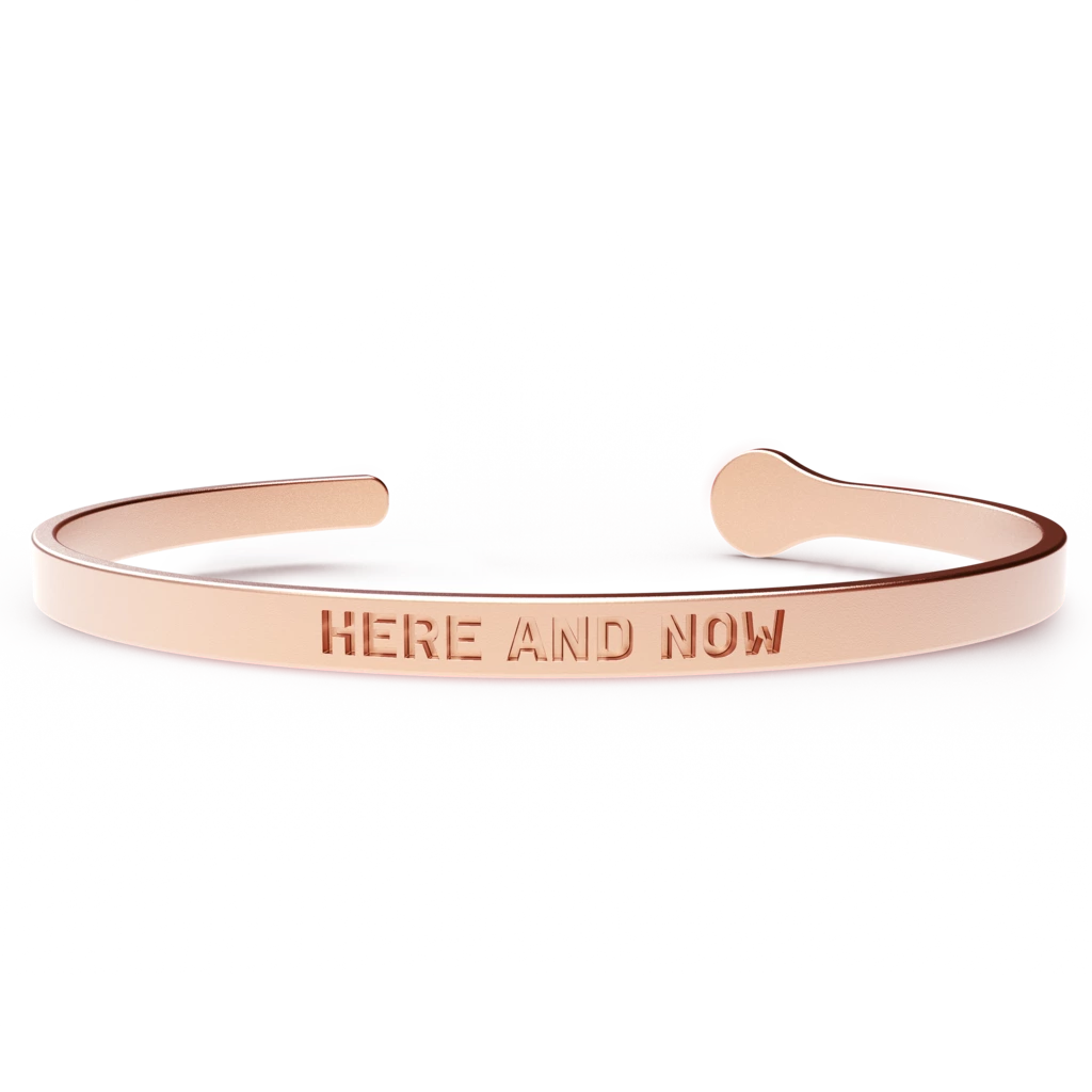 HERE AND NOW bracelet featuring a sleek design, hypoallergenic stainless steel, and a luxurious 24k gold coating, suitable for most wrist sizes.