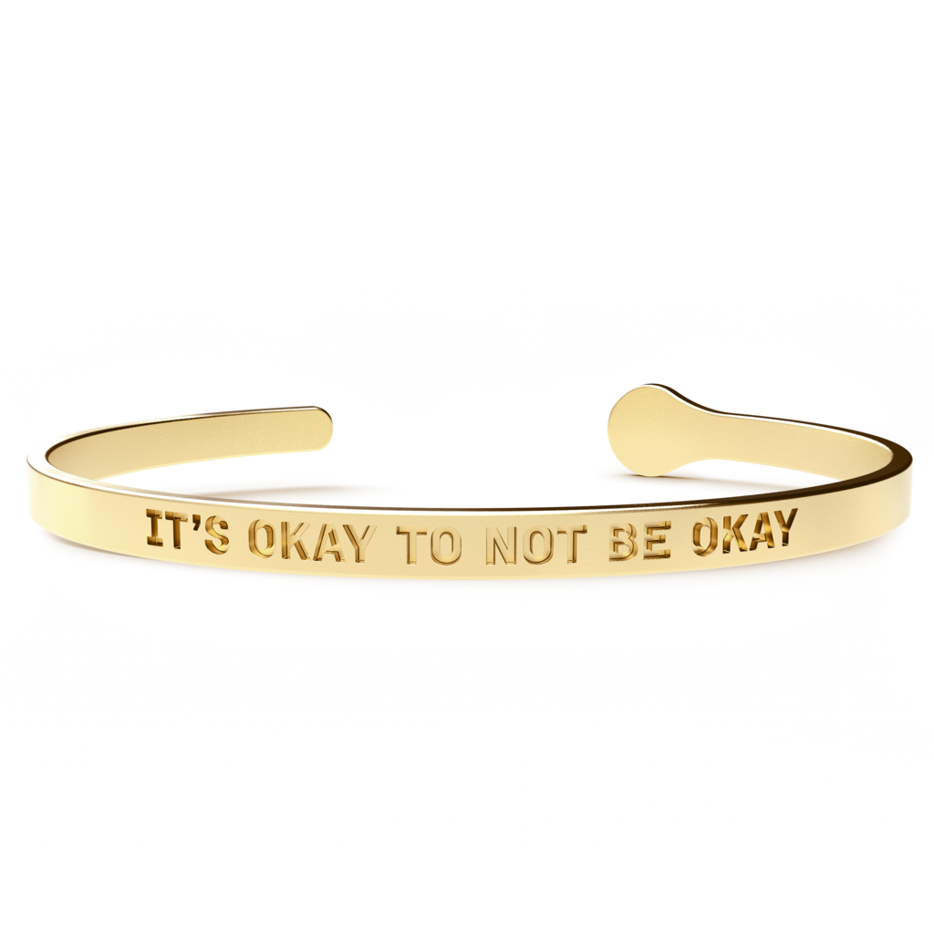 A stylish 'It's Okay to Not Be Okay' bracelet made of hypoallergenic stainless steel with a 24k gold coating, designed to fit most wrist sizes.