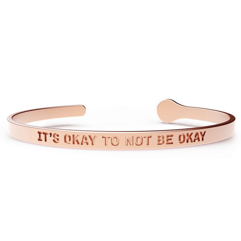 A stylish 'It's Okay to Not Be Okay' bracelet made of hypoallergenic stainless steel with a 24k gold coating, designed to fit most wrist sizes.