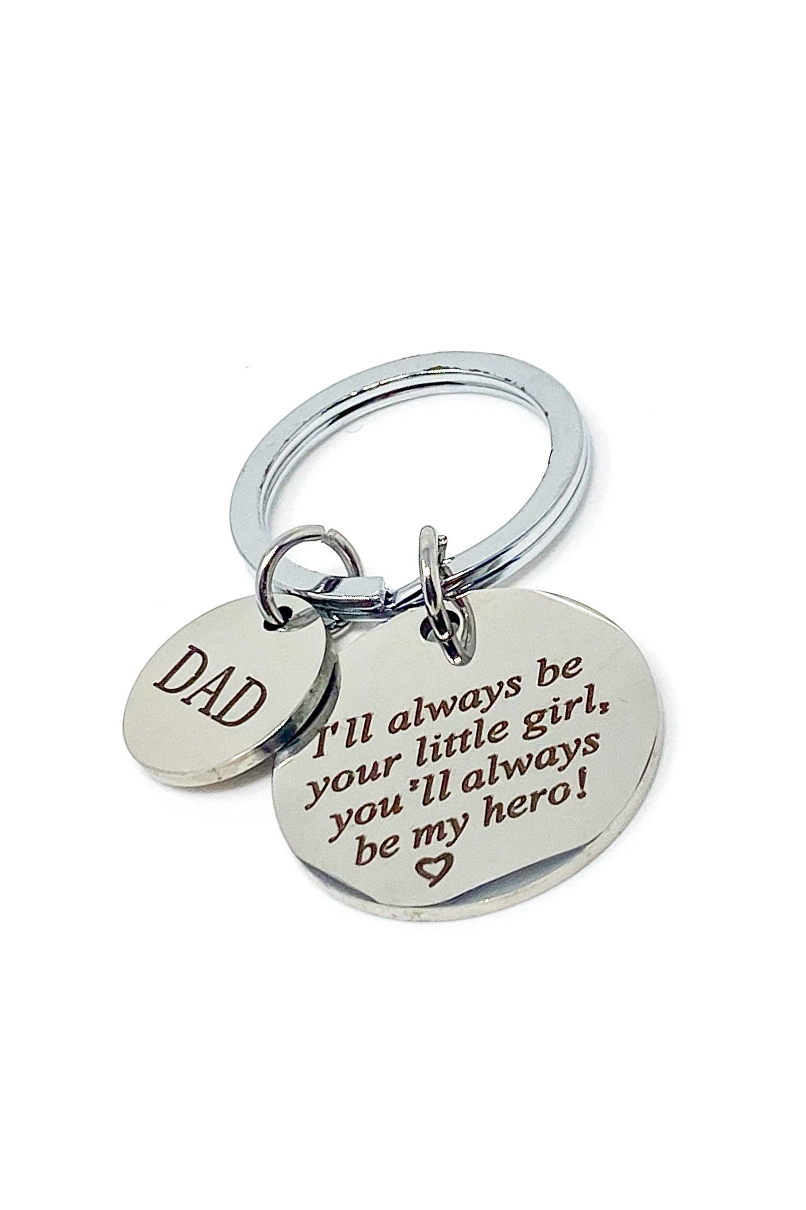 A silver keychain engraved with 'Dad My Hero', made from high-quality zinc alloy, showcasing its elegant design and durability.