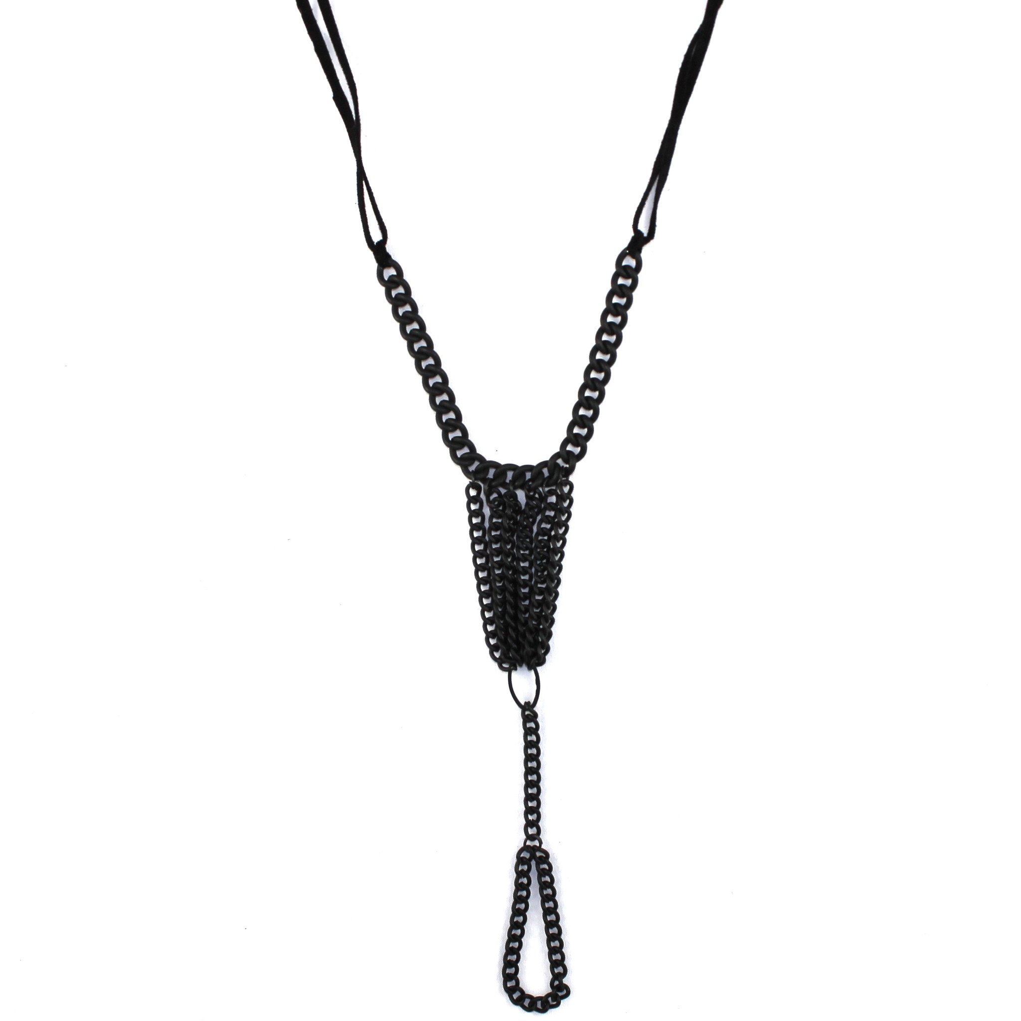 Onyx Hand Chain featuring a matte black chain and genuine suede ties, elegantly draping with a middle finger ring.