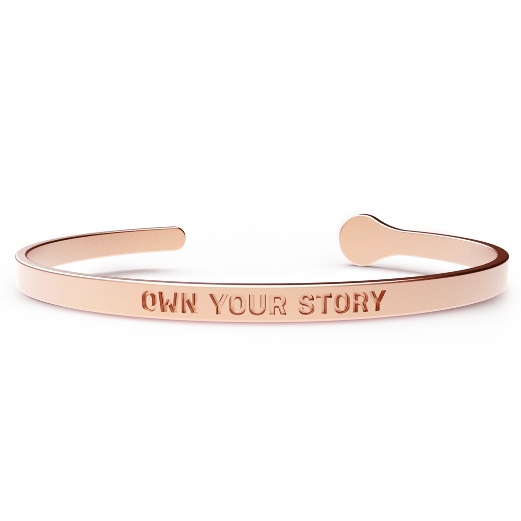 A stylish OWN YOUR STORY bracelet made of hypoallergenic stainless steel with a 24k gold coating, designed to fit most wrist sizes comfortably.