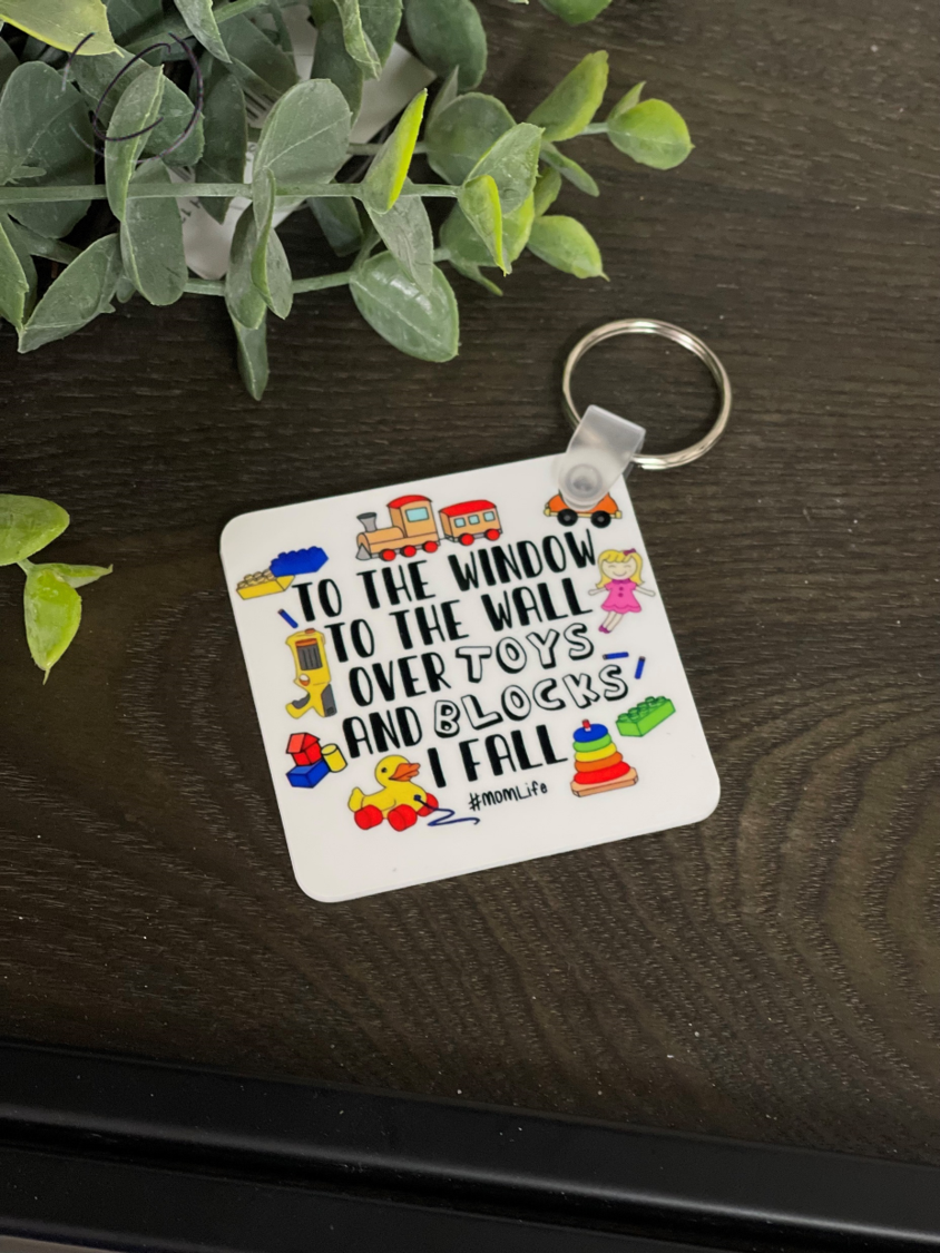 Toys & Blocks I Fall Keychain featuring a vibrant design on both sides, made from durable plastic, measuring 2.25 inches square.