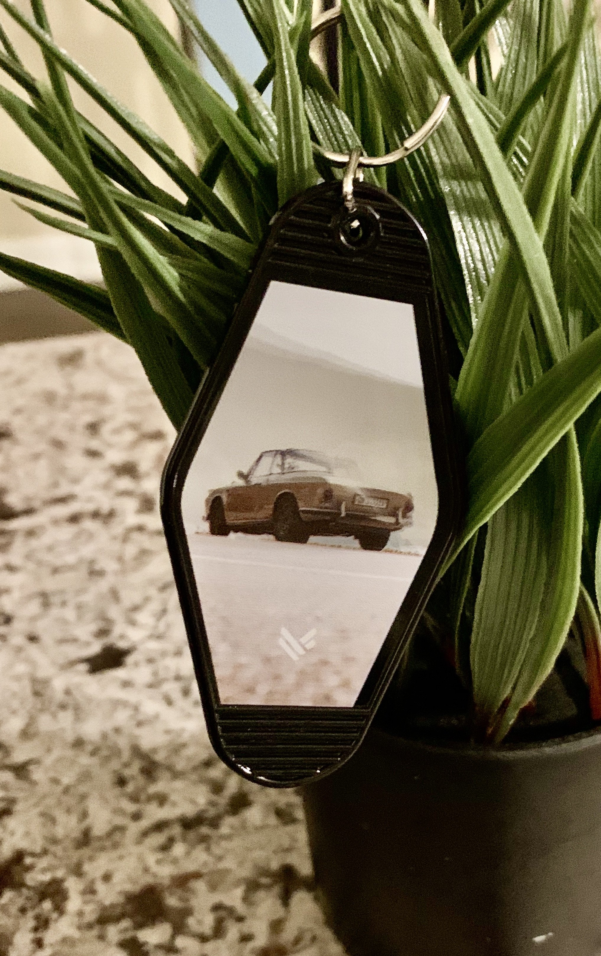 Vintage Car Retro Motel Key Tag featuring a black background and a printed vintage car design, measuring 3.5 inches by 1.75 inches.