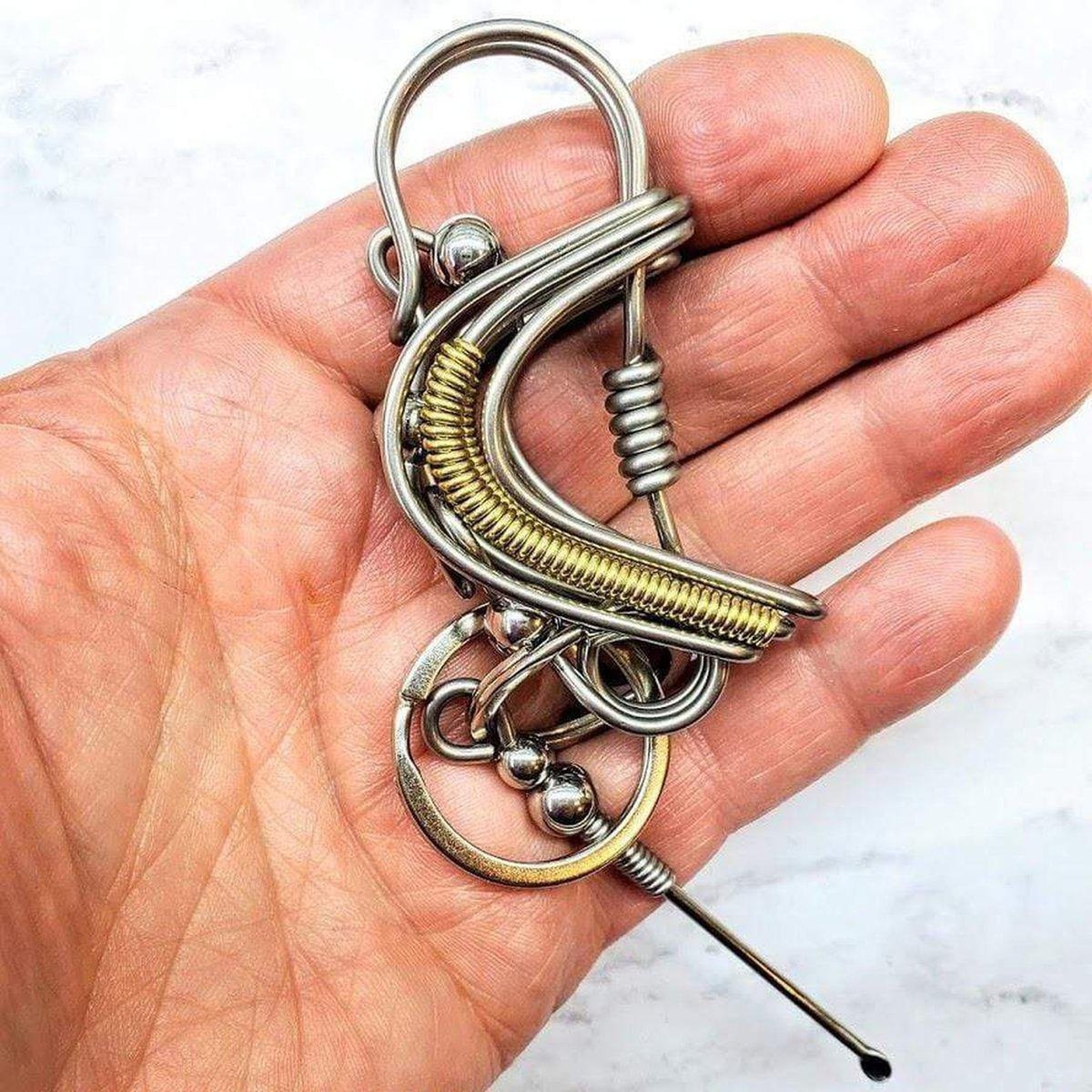 Wire Coiled Birdie Keychain for Him, featuring a sturdy steel wire design with brass-accented wings, measuring 2.5 inches in length.