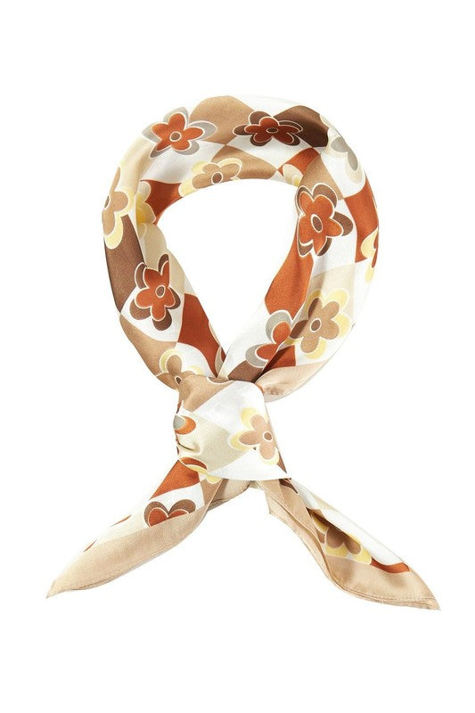 A vibrant abstract leaf printed silky square scarf, showcasing intricate leaf patterns in rich colors, perfect for stylish accessorizing.