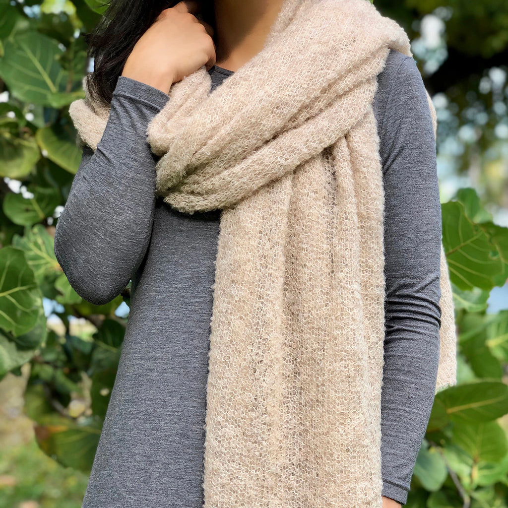 Almond Ultra Plush Alpaca Scarf displayed elegantly, showcasing its soft texture and oversized design, perfect for warmth and style.