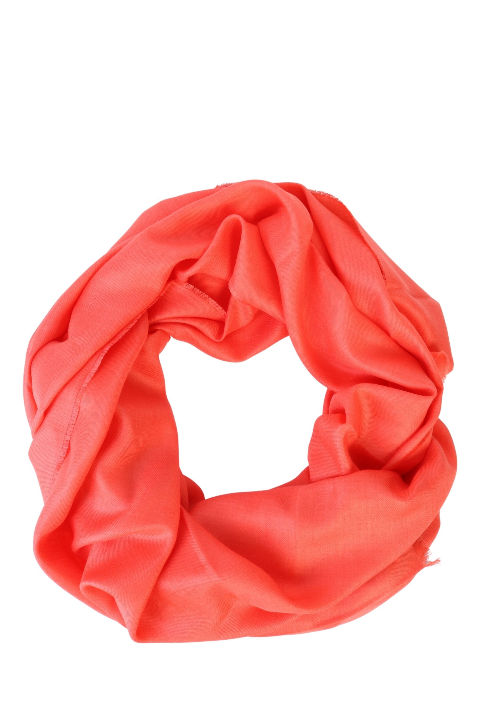 Luxurious coral shawl made from 70% royal alpaca wool and 30% silk, showcasing its soft texture and elegant design.