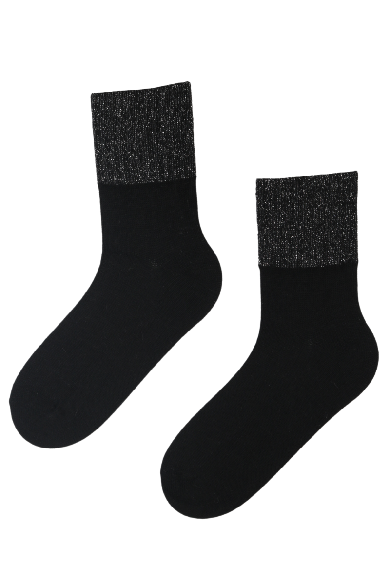 A pair of black alpaca wool socks with a glittery ribbed edge, showcasing their luxurious texture and stylish design.