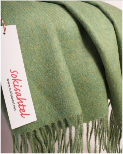 Luxurious light green plaid made from 100% alpaca wool, showcasing its soft texture and elegant design.