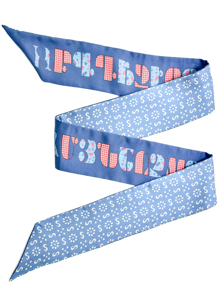 Armenian Alphabet Blue narrow scarf made of silk twill, featuring historic Bible cover design and ornamental patterns, elegantly displayed in a gift box.