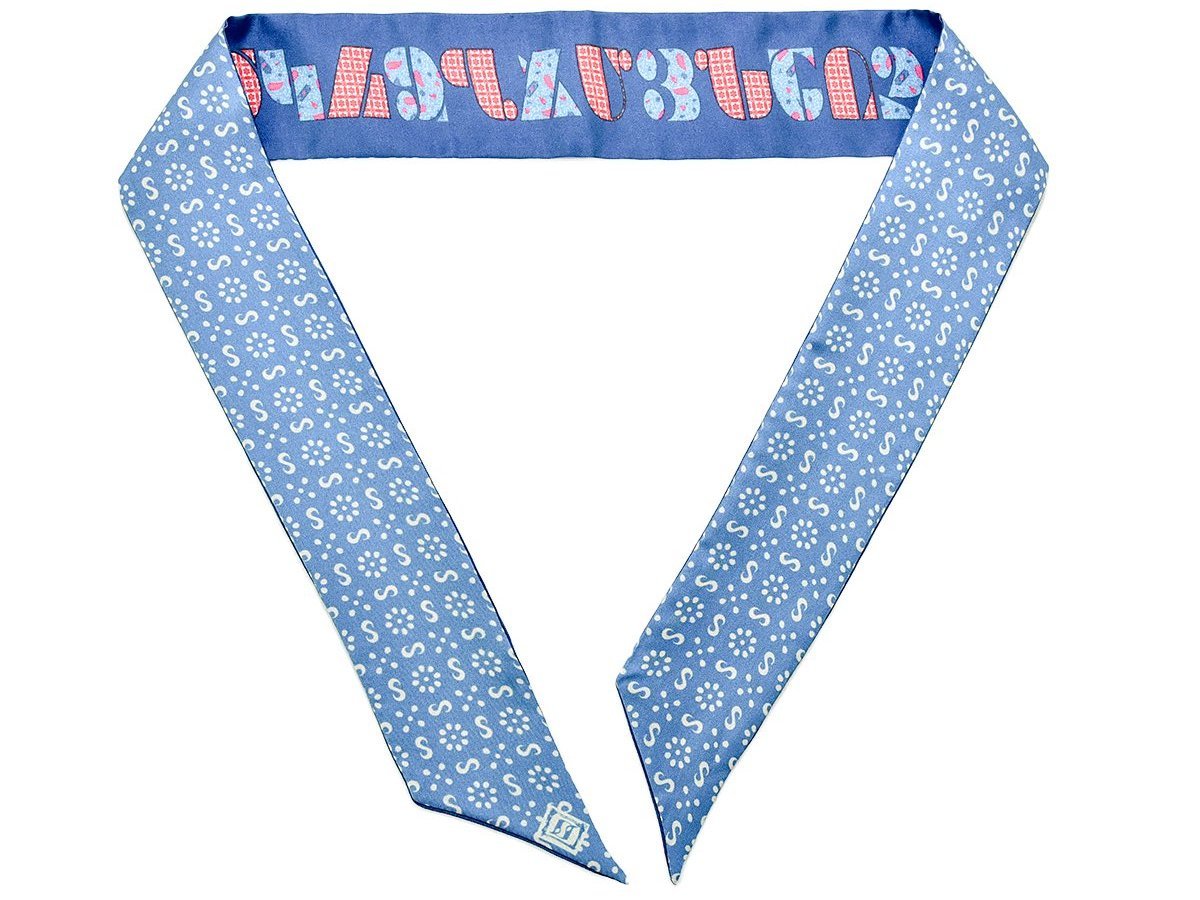 Armenian Alphabet Blue narrow scarf made of silk twill, featuring historic Bible cover design and ornamental patterns, elegantly displayed in a gift box.