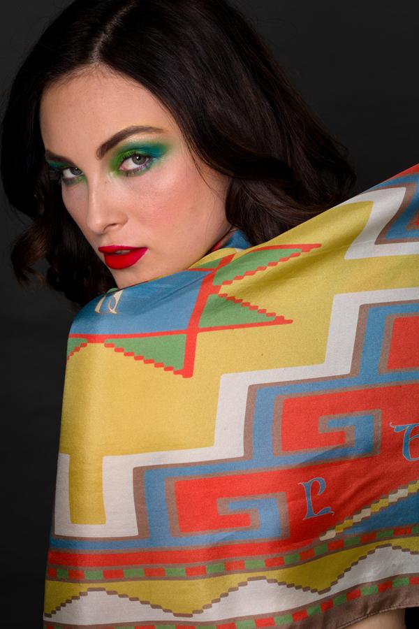 Armenian Alphabet Scarf #3 featuring pastel colors and traditional carpet motifs, elegantly displayed in a gift box.