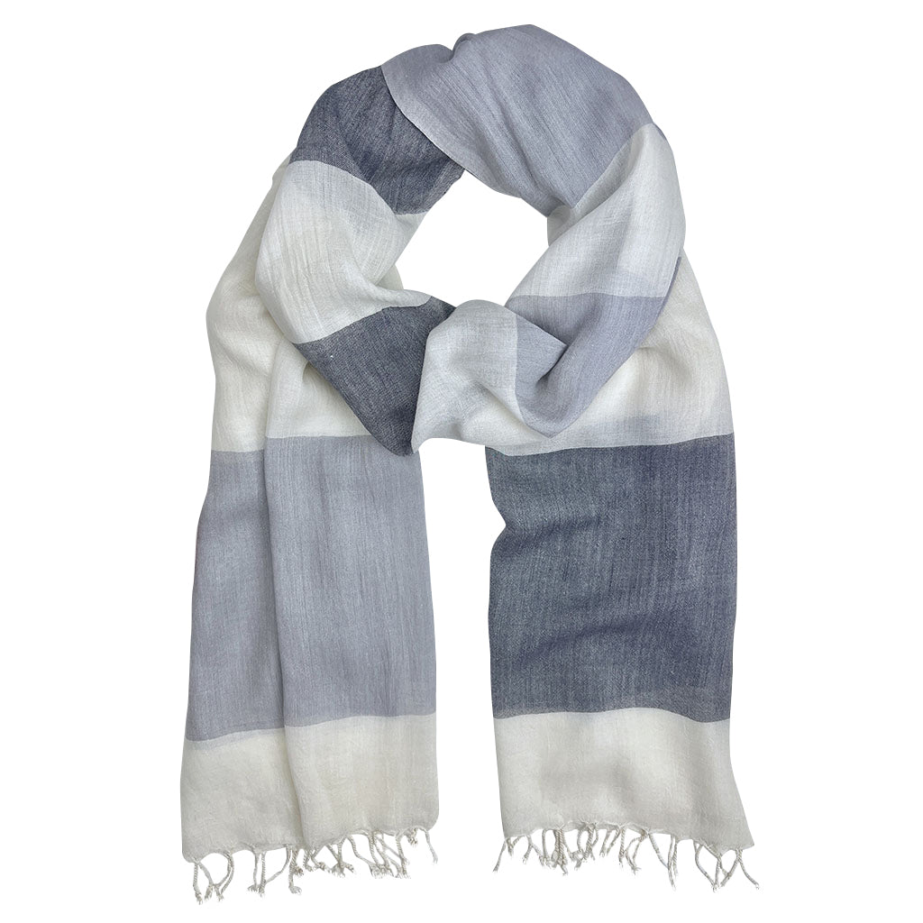 A beautifully hand-loomed Bold Stripe Milk Yarn Scarf showcasing unique stripes and soft texture, made from sustainable milk protein fibers.