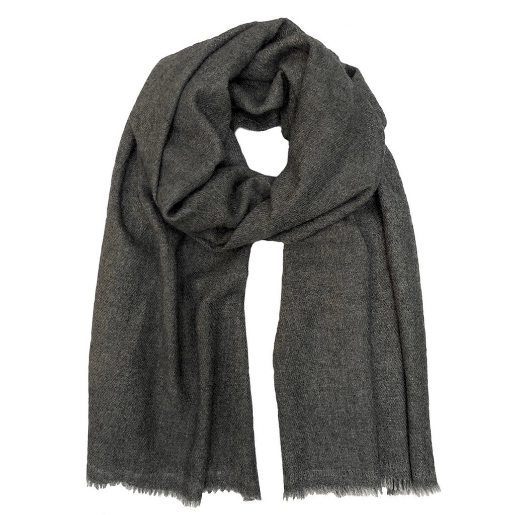 A luxurious charcoal handloom cashmere scarf, showcasing its soft texture and unique patterns, perfect for cold weather layering.