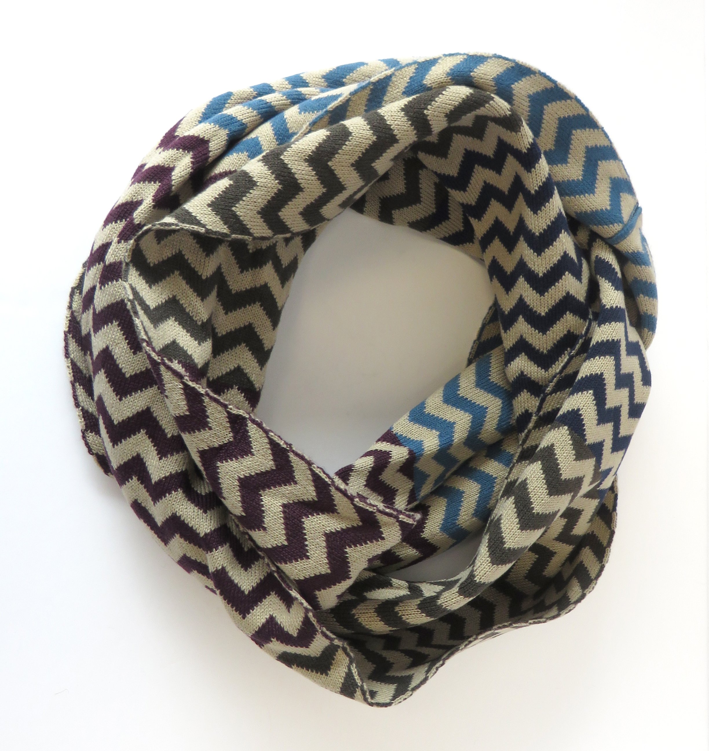 Nicci Chevron Loop Scarf in purple and turquoise, showcasing its vibrant colors and soft texture.