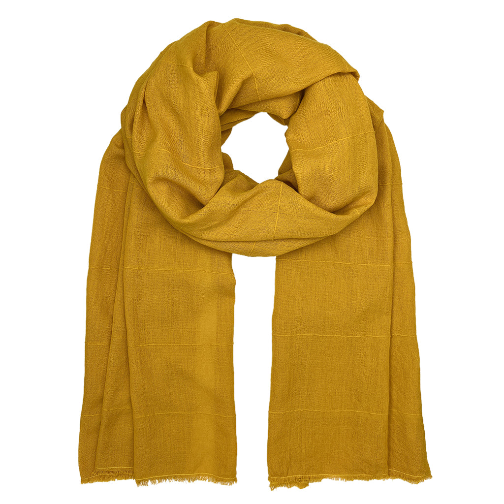 A vibrant oversized Classic Cotton Wrap Scarf hand-loomed from pure Ethiopian cotton, featuring an eyelash fringe edge.