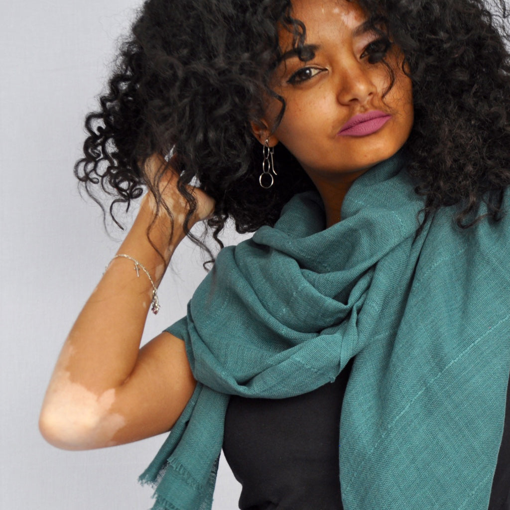 A vibrant oversized Classic Cotton Wrap Scarf hand-loomed from pure Ethiopian cotton, featuring an eyelash fringe edge.